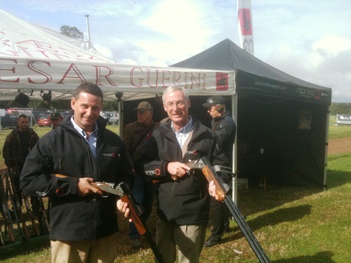 Kevin Gill and Mike Mansfield in front of the booth at the shooting line at Midlands game fair